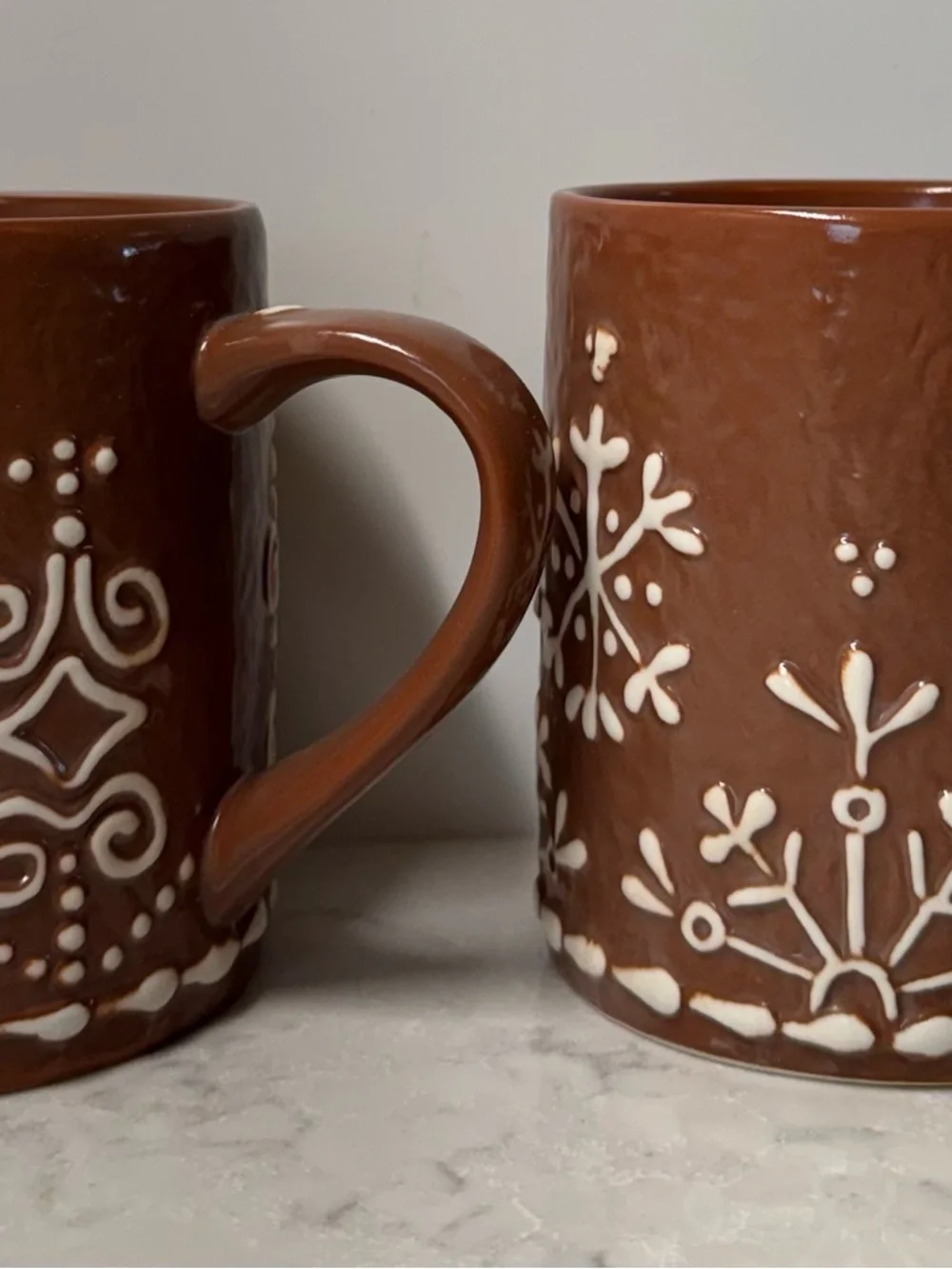 Pottery Barn Brown Ceramic Mug with White Snowflake Design